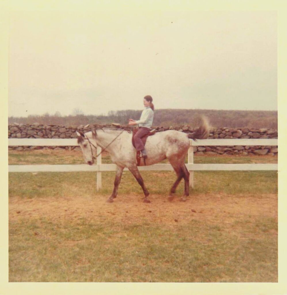 As a kid, Elly McGuire would visit her Aunt and Uncle on their farm in Ri. In this picture, Elly is riding an Arabian Horse named Nassar. Until he throws her off. But she gets back upon that horse! And falls off again . . .