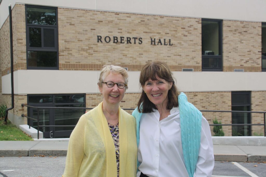 Dr. Nancy Carriuolo, former President of Rhode Island College posing with Elly McGuire back in 2016 - in front of Roberts Hall on the campus of RIC.